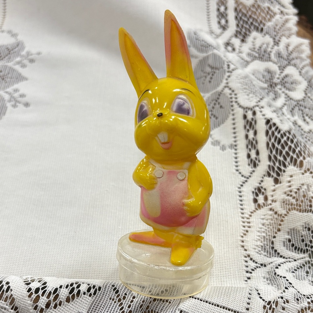 vintage yellow plastic Easter bunny candy cont., likely from the 1950s